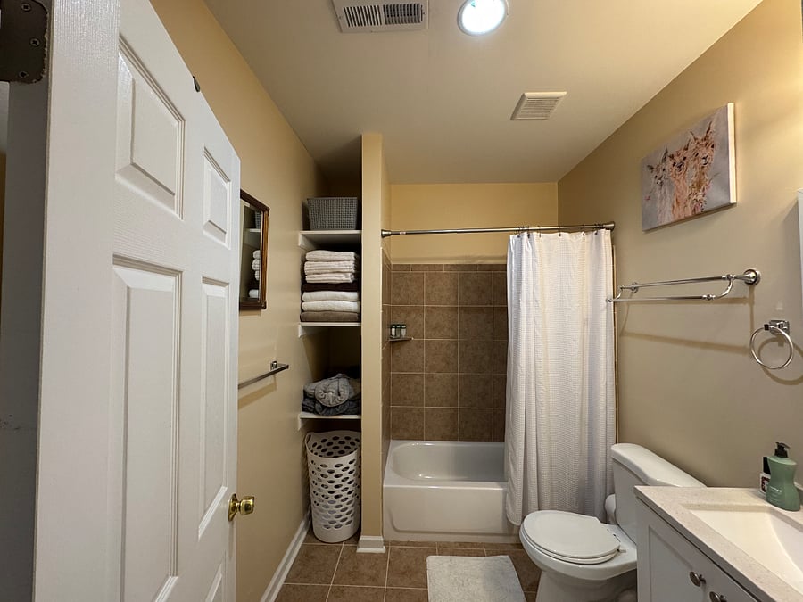 Bathroom (view 1); Shower and tub; exhaust fan, ample towels, two robes, blow dryer, hair straightener, and starter, and starter cleaning/toiletry essentials