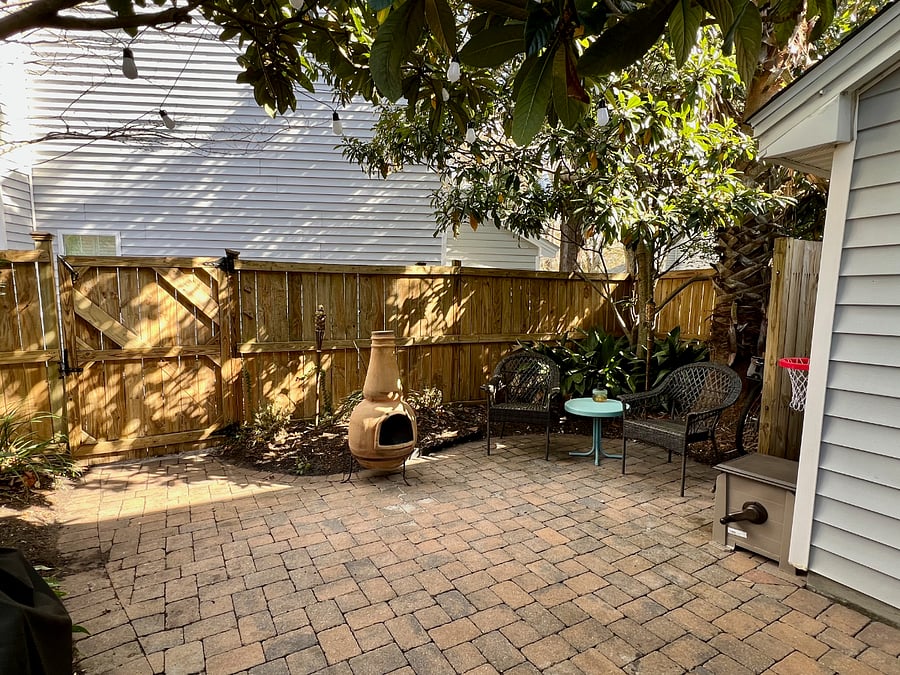 Naturally shaded, private patio with beautiful magnolia and palm trees