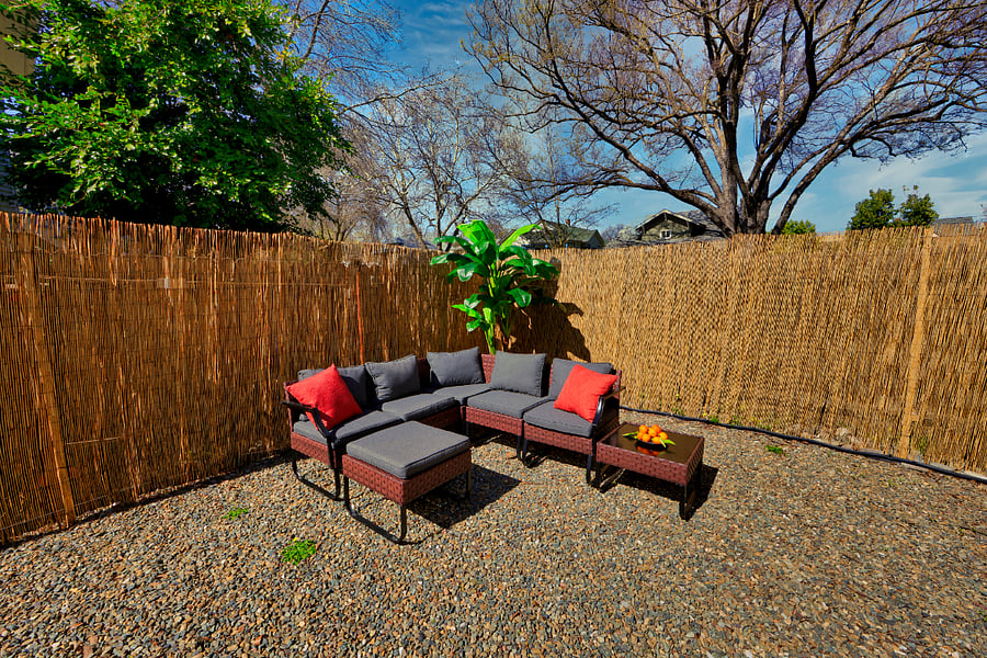 Large fenced in backyard, with orange trees, patio furniture, and grill- corn hole outdoor game also at tenant's disposal.