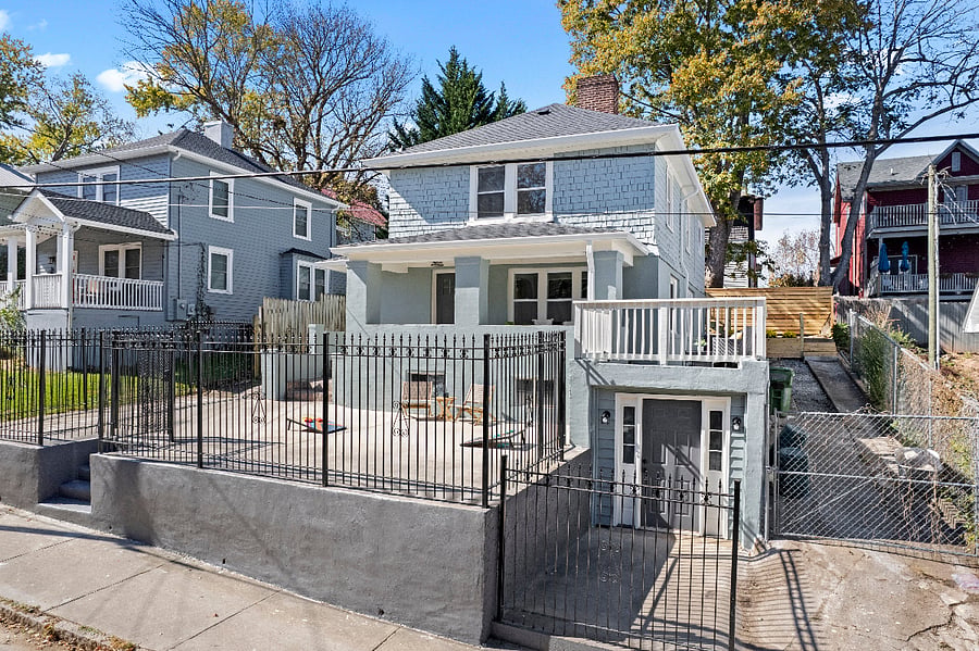 Plenty of deck space with a grill, picnic table, chairs and planters