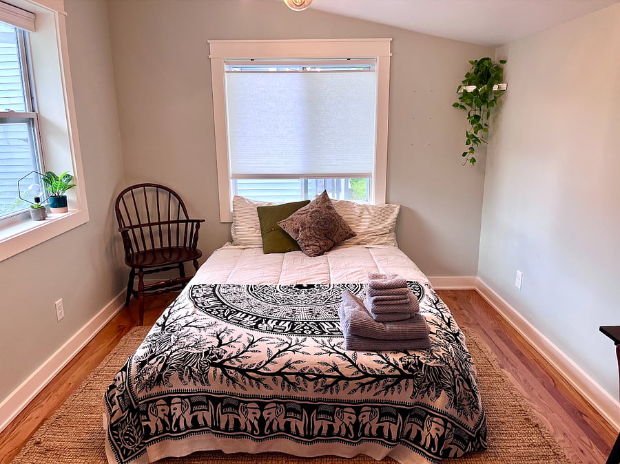 Guest room / office with desk, futon, and closet