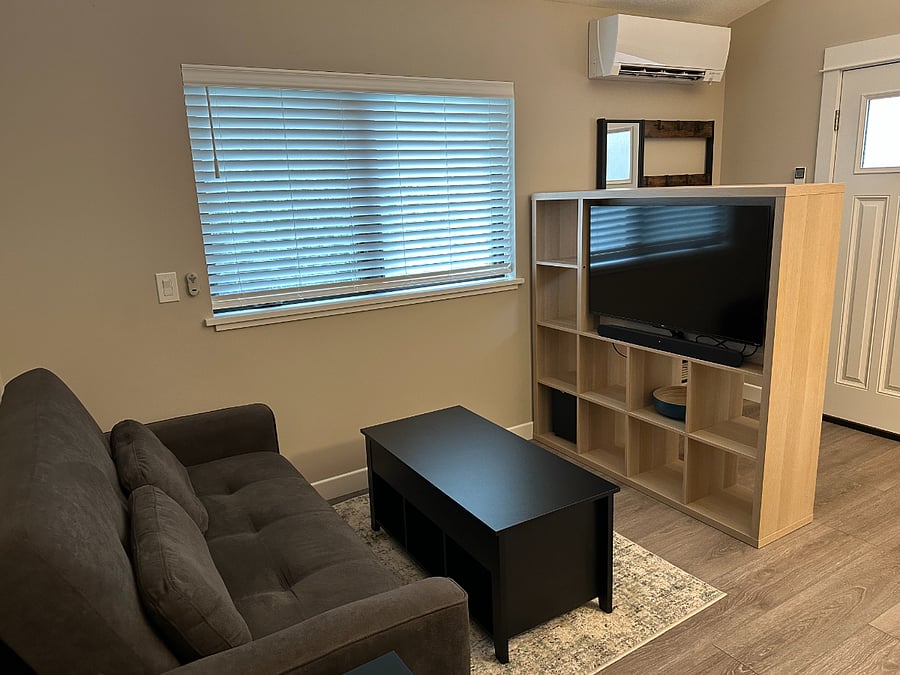 Roku TV with soundbar, elevating coffee table and convertible couch