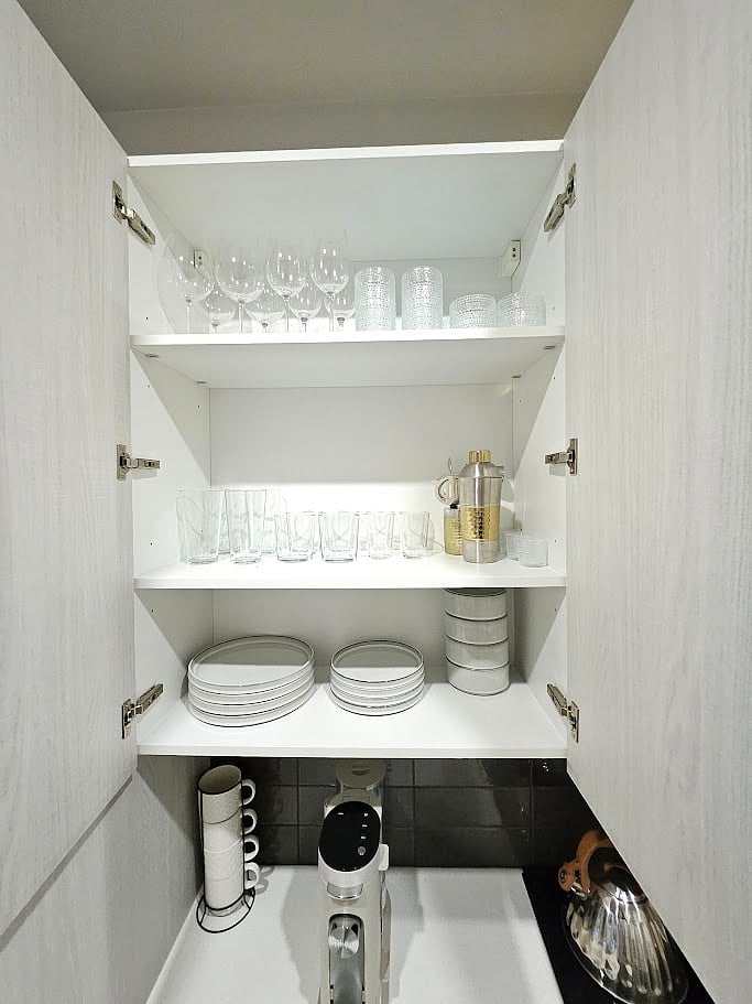 Stoneware dishes, glassware, barware, and cocktail glasses.