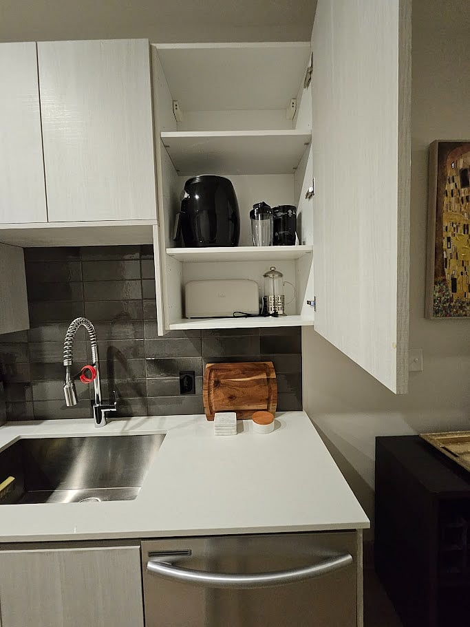 Air fryer, toaster, Ninja blender, and French press.