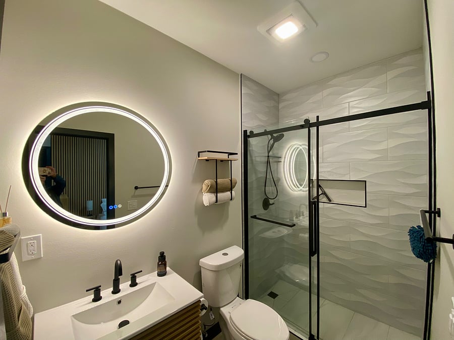 LED mirror, overhead recessed lights and humidity sensor to control moisture in bathroom