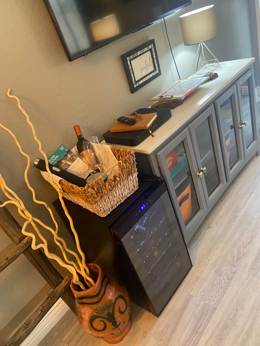 Wine fridge to keep your wine chilled. Along with games and toys for the little ones.