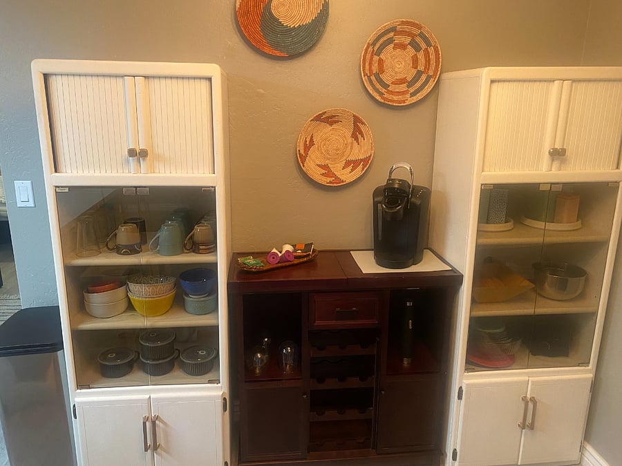 Coffee and tea bar with dishes and extra essentials.