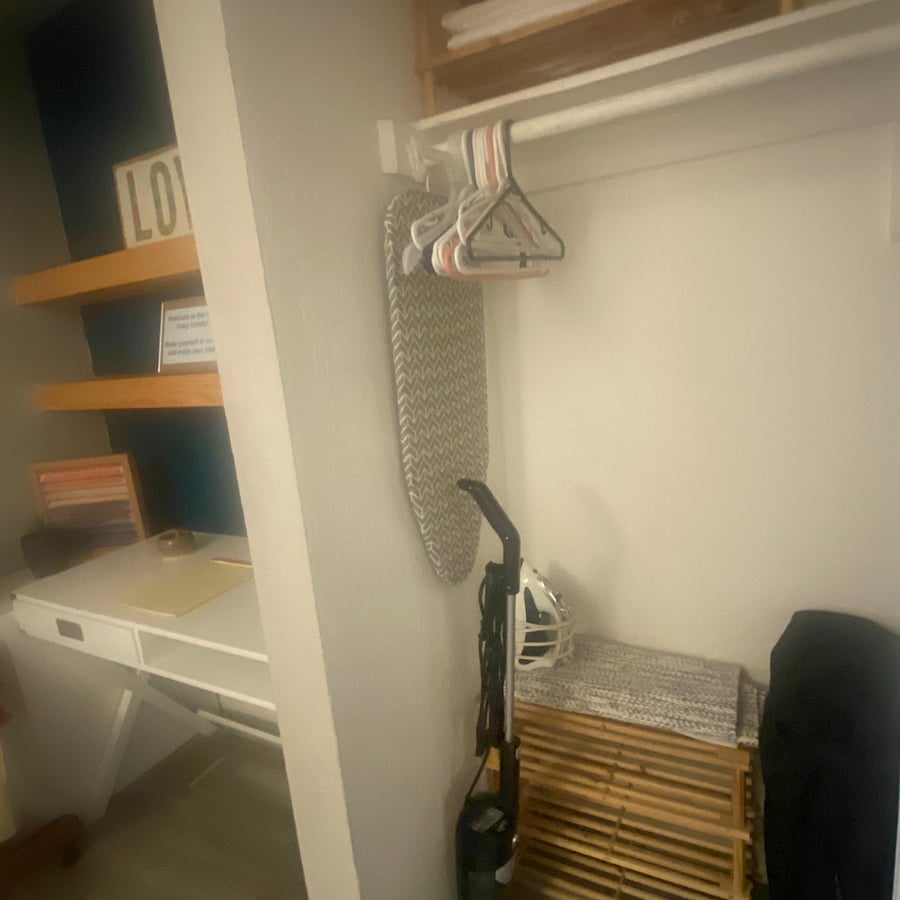 Full size closet with hangers, small portable crib. Ironing board, with steamer. Box fan and shoe rack included.