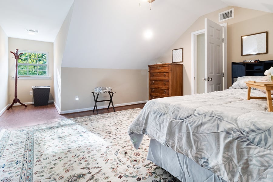 Upstairs in the bedroom there is a queen sized bed with a headboard that includes outlets for your technology and storage for your books!