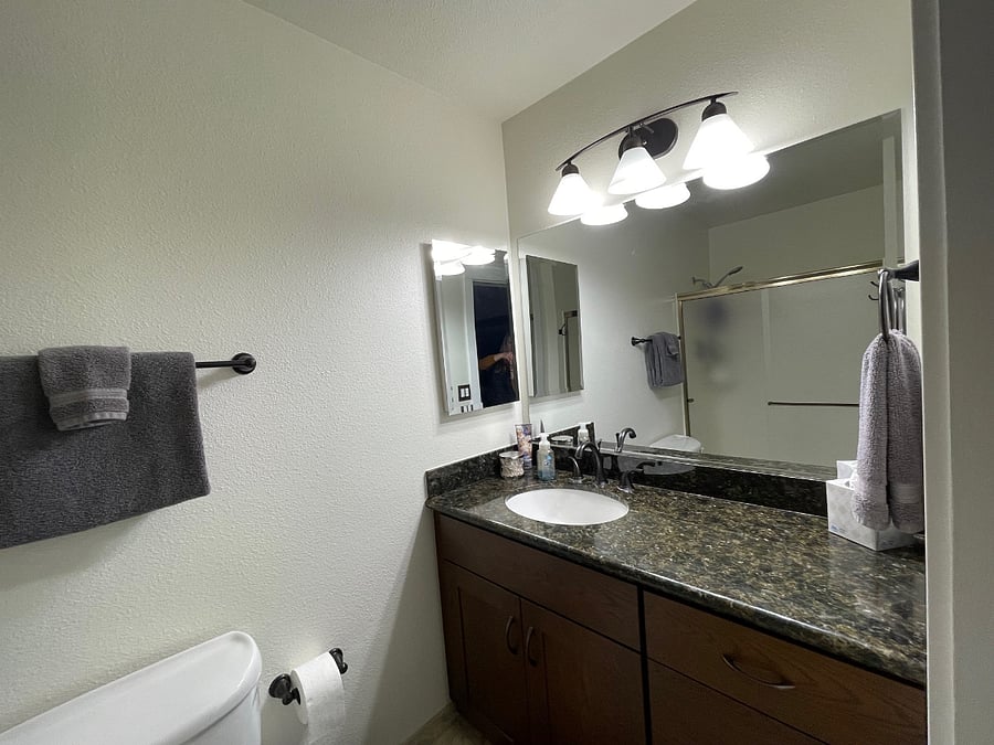 Bedroom #2 & En-suite Bathroom: Has toilet, shower and sink (photo taken from bathroom entry).