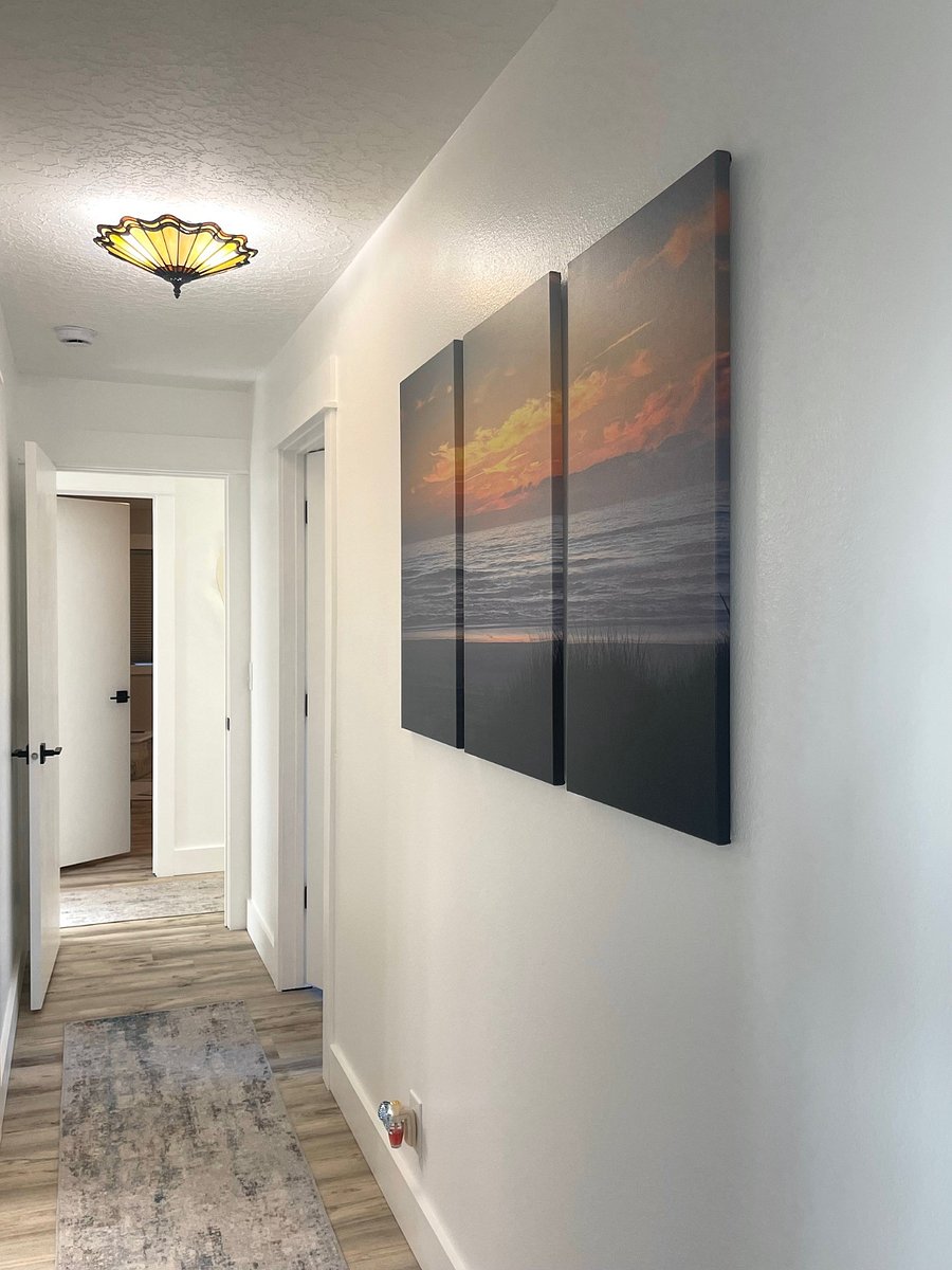 Hallway provides access to bedroom #3 - featuring full-sized bunk beds and twin-sized trundle bed. Third guest bathroom is conveniently located across from bedroom #3 (photo taken from house foyer/entry area).