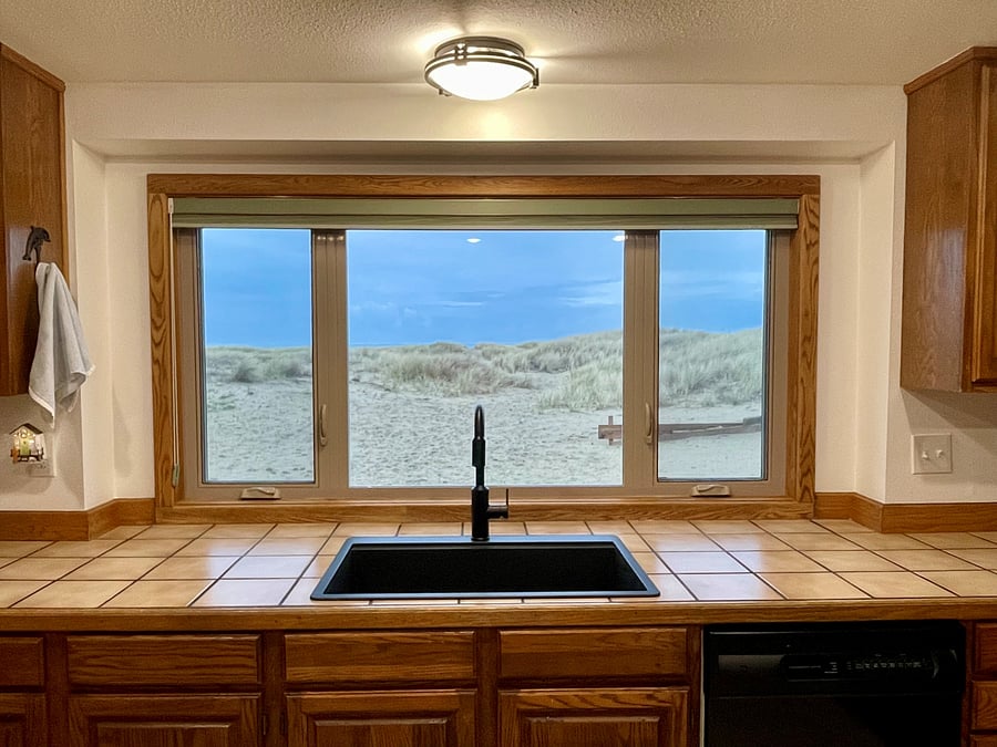 Kitchen overlooking patio and views of the ocean (photo take from within kitchen).