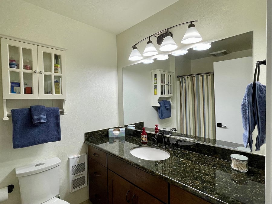 Bathroom #3: Conveniently located across from bedroom #3. Includes shower with tub, toilet and sink (photo taken from bathroom entry).