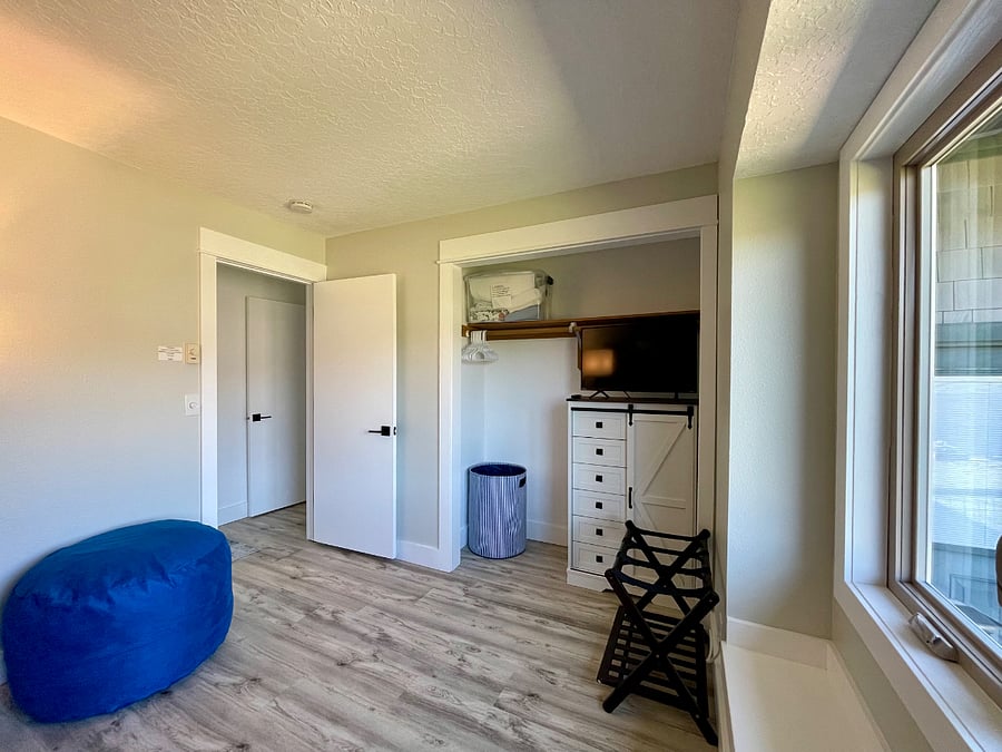 Bedroom #3: Features full-sized bunk beds and twin sized trundle bed and Roku TV. Third bathroom with tub, shower, toilet and sink, located directly across from bedroom #3 (photo taken from bunk beds).
