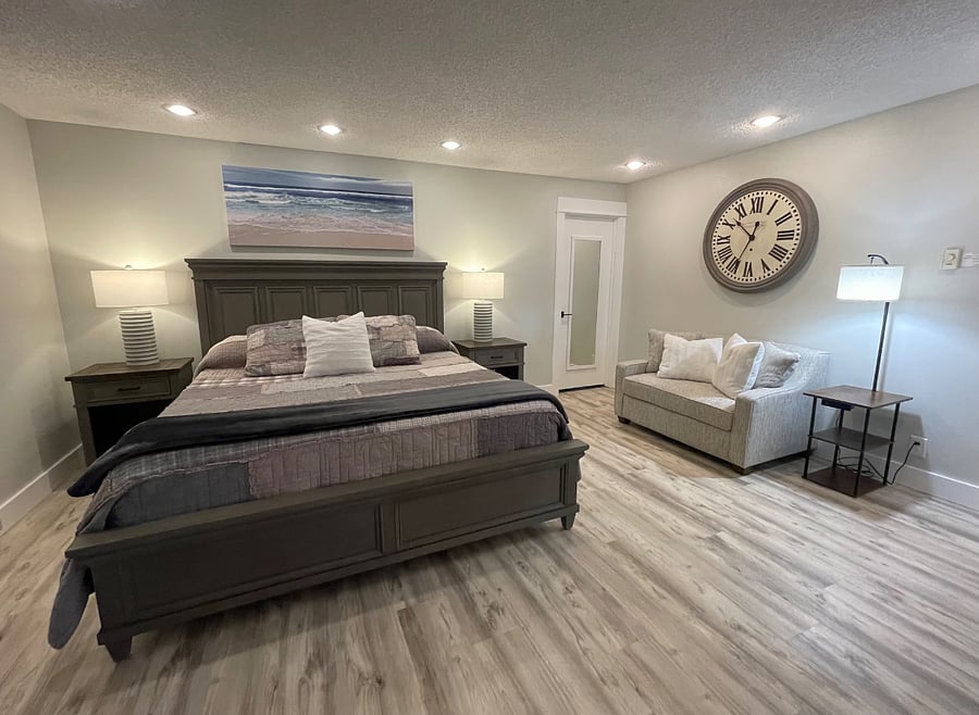 Bedroom #1 offers tons of space, king-sized bed, twin pull-out sleeper soft, en-suite bathroom, lots of closet space and smart TV.