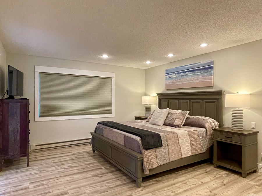 Bedroom #1 offers tons of space, king-sized bed, twin pull-out sleeper soft, en-suite bathroom, lots of closet space and smart TV.