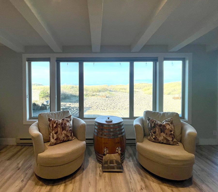 View of back patio/yard and ocean (photo taken from living room).