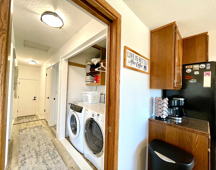 Full-sized washer and dryer located off the kitchen and across from pantry.