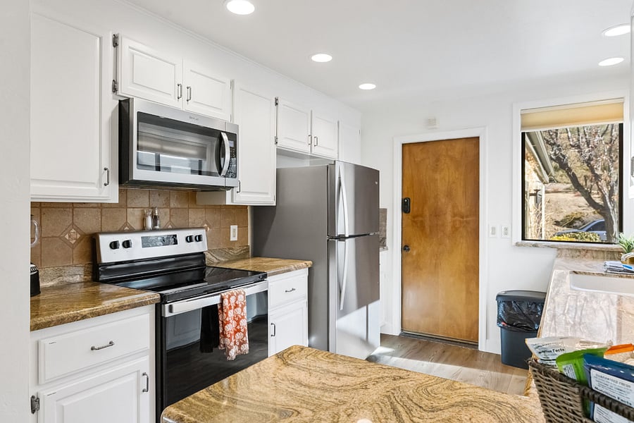 A fully equipped kitchen featuring modern appliances, generous counter space, and all the essentials for effortless and enjoyable meal preparation.