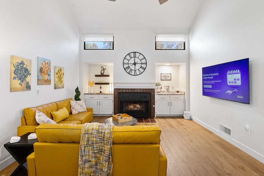 Enjoy the warmth of the fire in a stylish and inviting living room, designed for ultimate relaxation.
