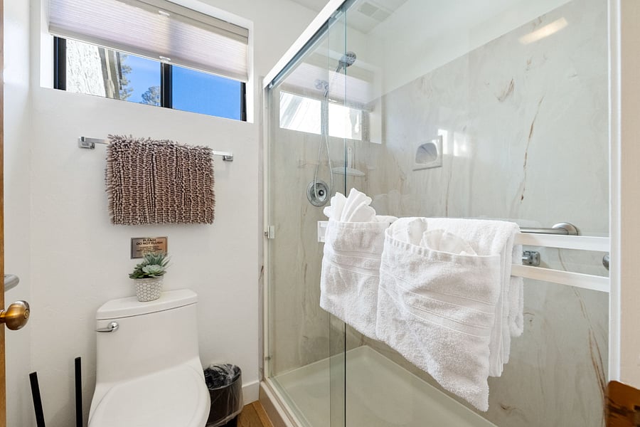 The master ensuite bath features a large walk-in shower and double vanities, combining style and convenience.