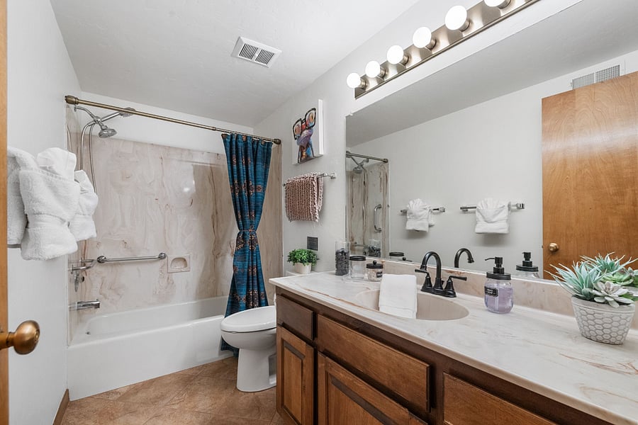 A spacious and convenient downstairs full bathroom, located just off Bedroom Two for easy access.