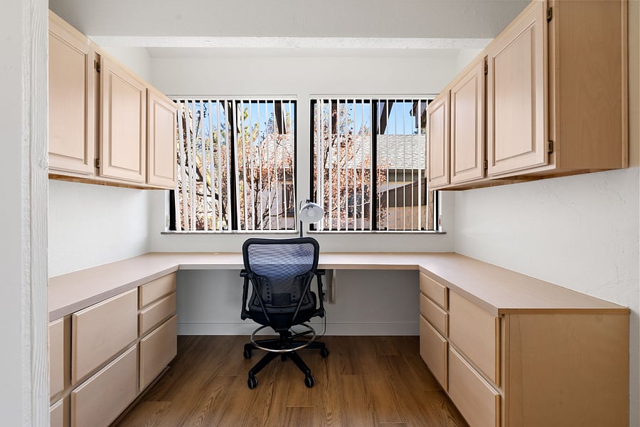 A spacious dedicated workspace featuring abundant natural light and scenic views, perfect for productivity and inspiration.