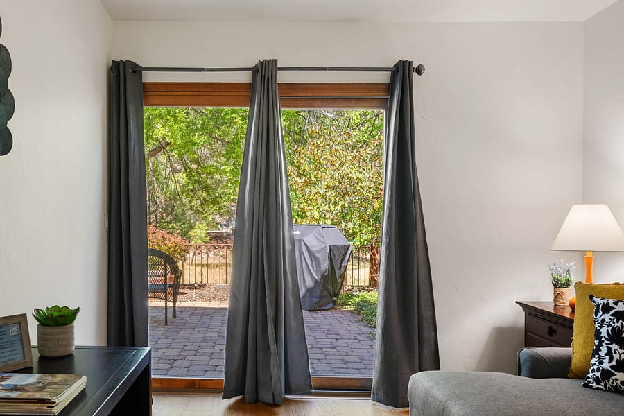 Bedroom 3 | Backyard Access
Bright, airy space with a cozy pull-out sofa and sliding doors that open directly to the backyard- perfect for enjoying peaceful views and easy access to nearby trails.