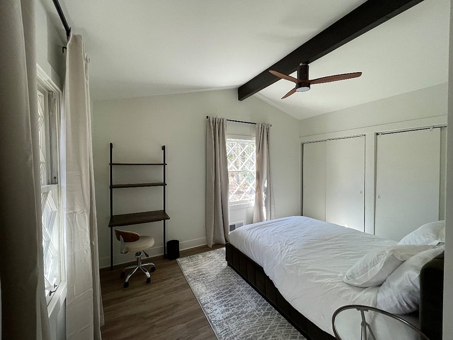 Bedroom 1- Queen with working station and beautiful windows overlooking the park. 