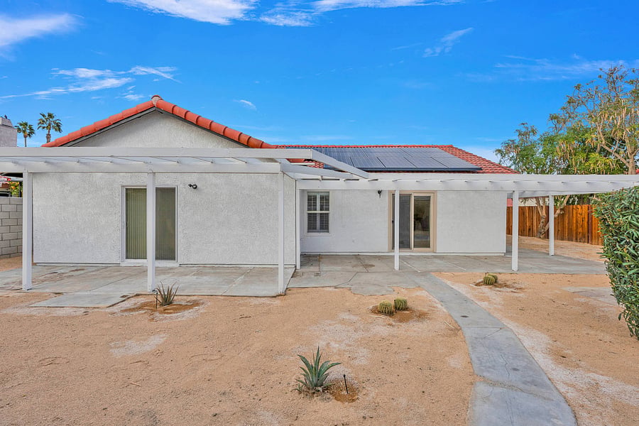 Pet friendly fully fenced backyard with desert landscape