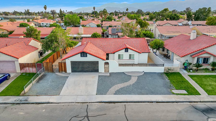 Front of home with desert landscape