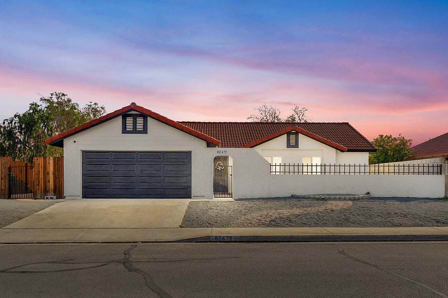 Front of home with desert landscape