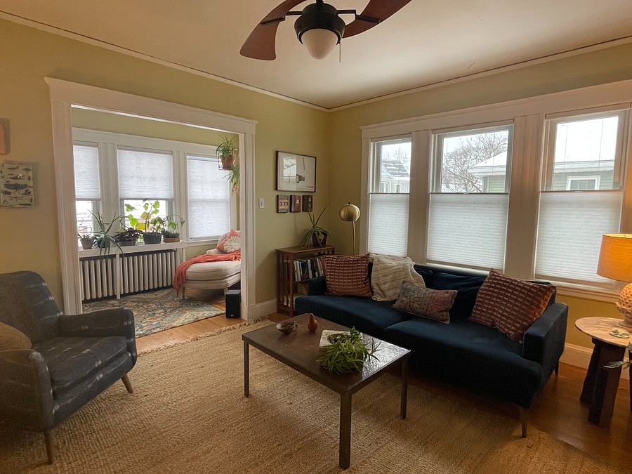 Shared living room and sunroom with lots of natural light
