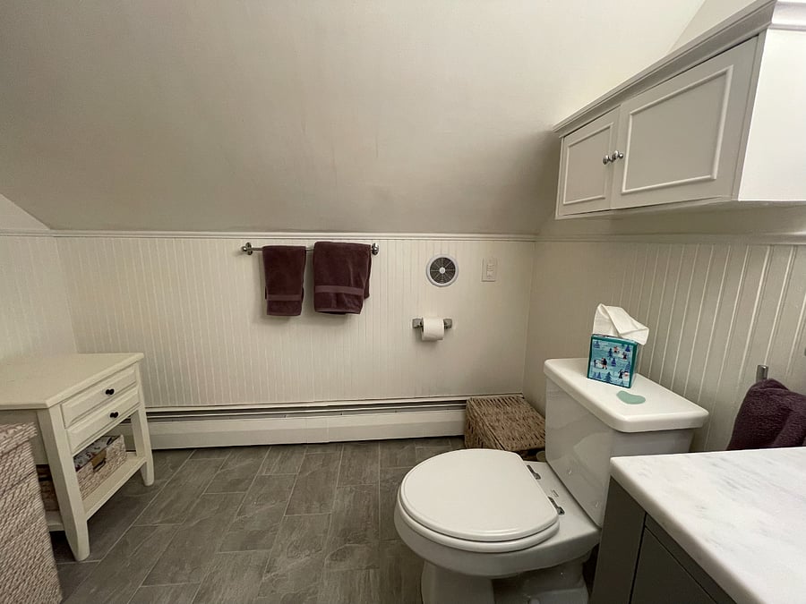 Generous sized bathoom with extra storage above toilet