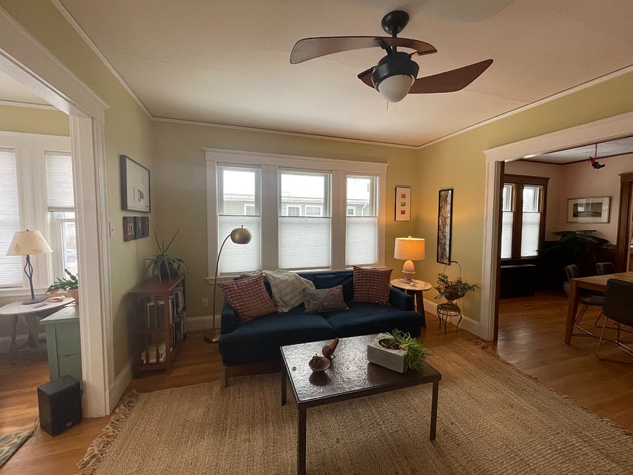 Living room; extra wide, sofa; dining room on right.