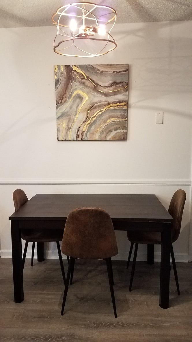 This table has a leaf and can extend it. Plus more chairs upon request.
