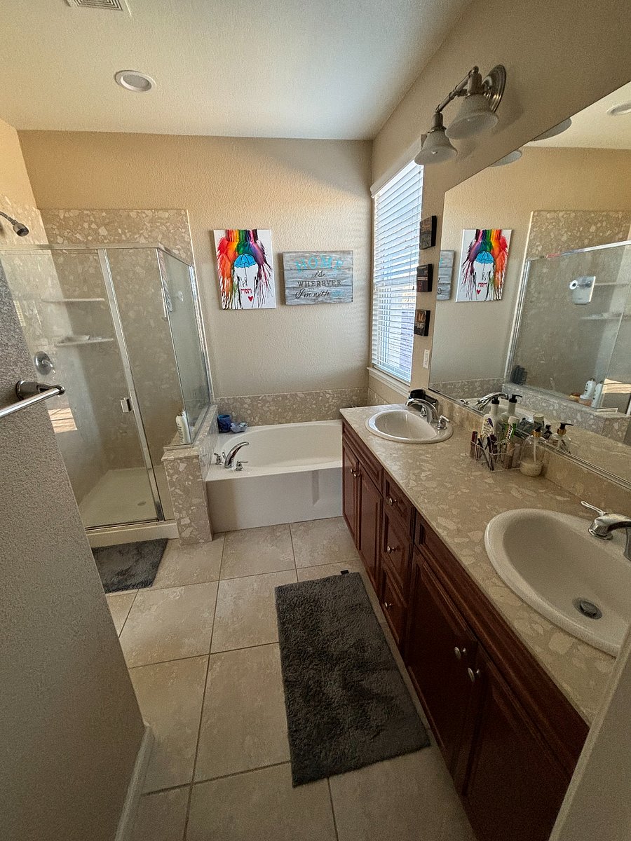 Main bathroom with shower and bathtub