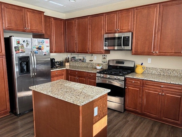Cherry wood cabinets, granite countertops, fridge, oven and microwave.