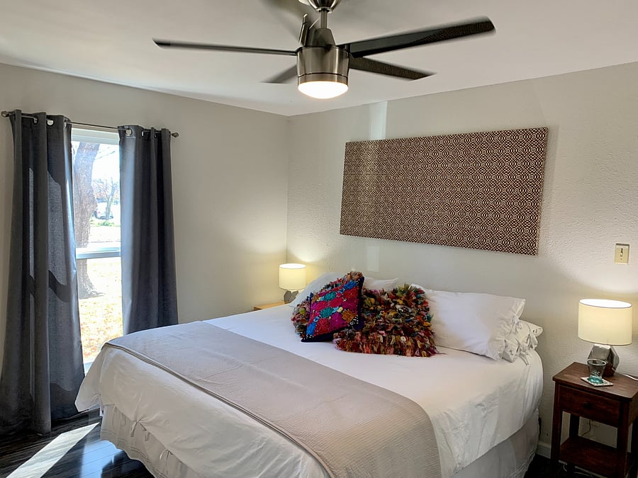 Master bedroom with king bed. Snuggle up for a for a restful night with cozy bedding. 