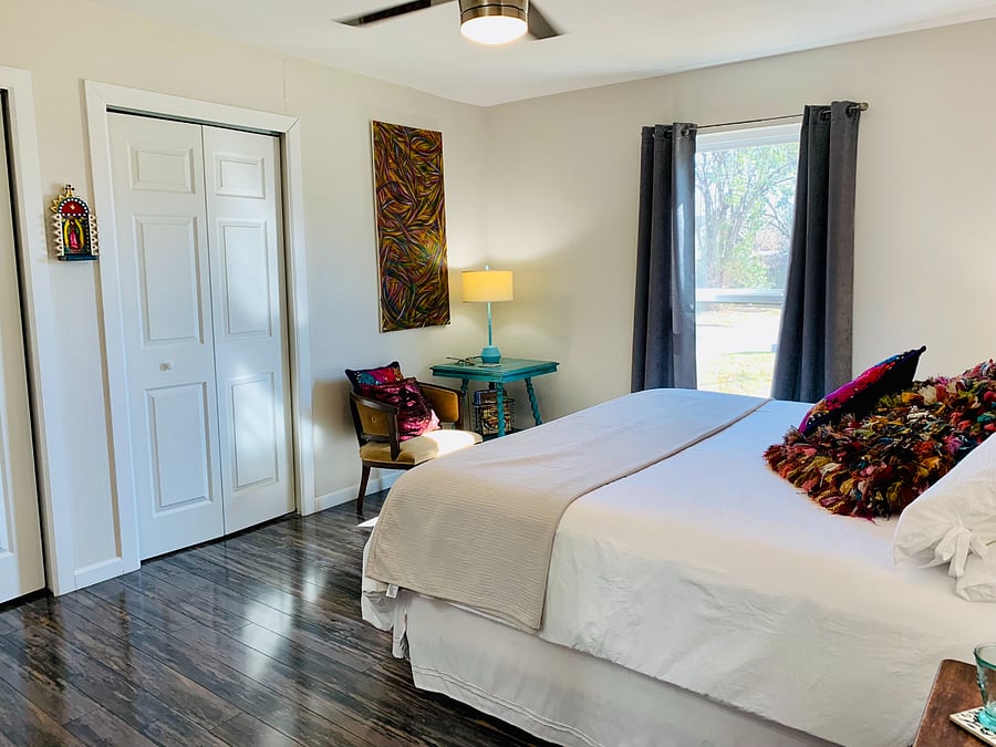 Master bedroom with king bed. Snuggle up for a for a restful night with cozy bedding. 