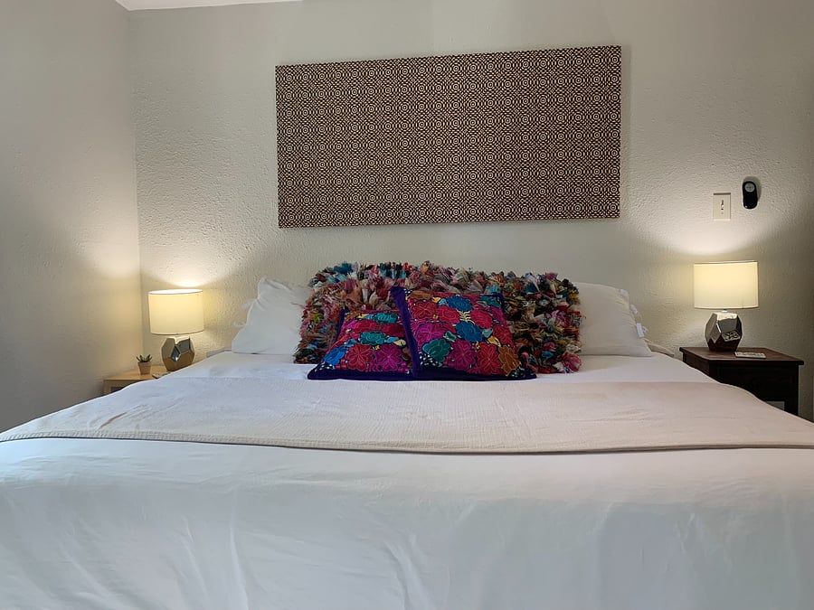 Master bedroom with king bed. Snuggle up for a for a restful night with cozy bedding. 