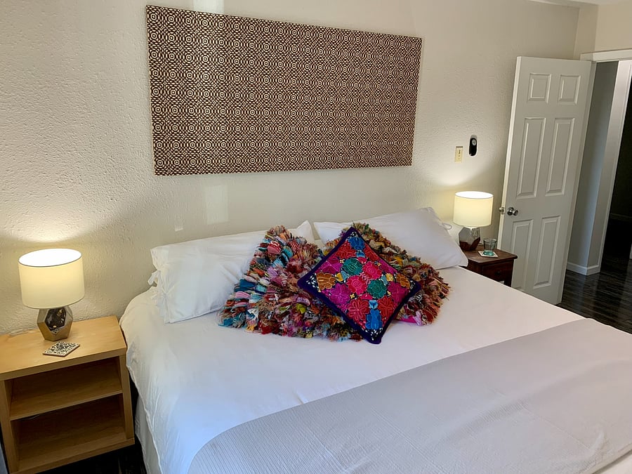Master bedroom with king bed. Snuggle up for a for a restful night with cozy bedding. 
