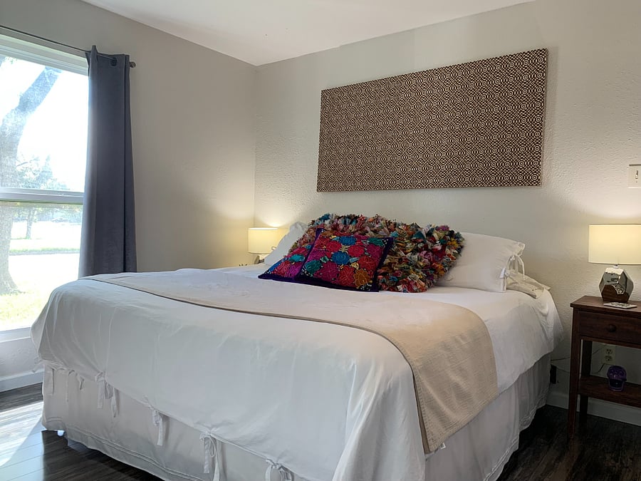 Master bedroom with king bed. Snuggle up for a for a restful night with cozy bedding. 