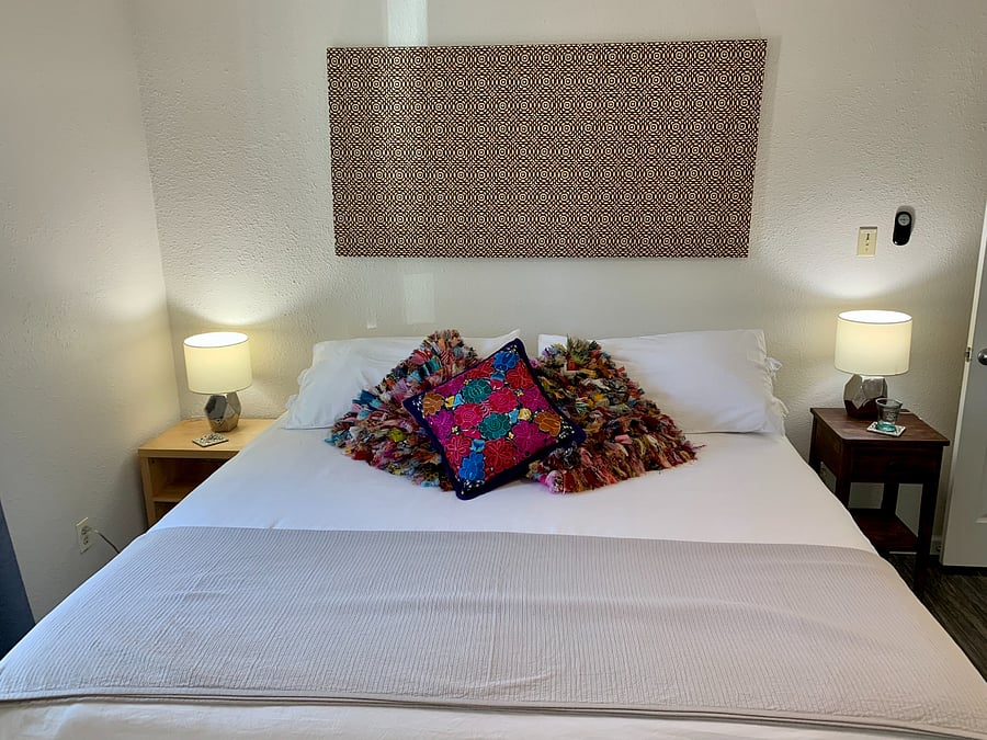 Master bedroom with king bed. Snuggle up for a for a restful night with cozy bedding. 
