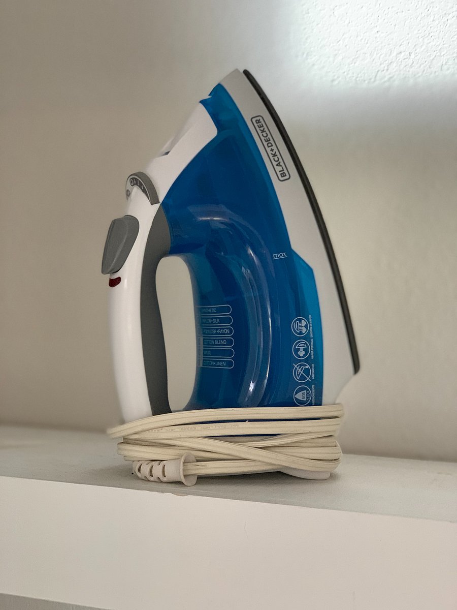 Iron, ironing board, and a garment steamer.