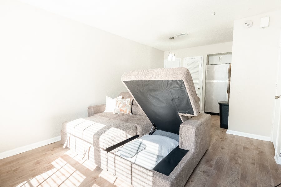 Pull out couch with extra sheets/pillow storage.