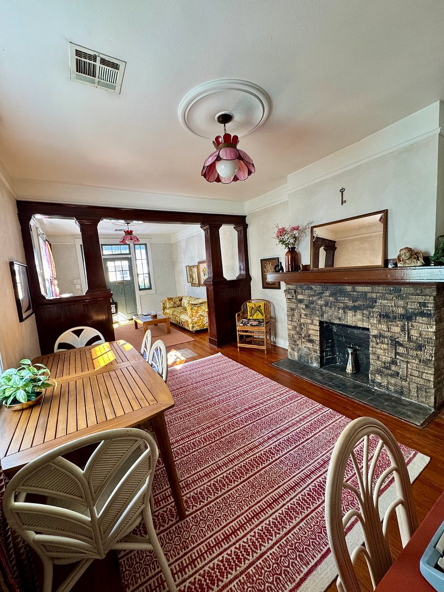 View of decorative fireplace and living room