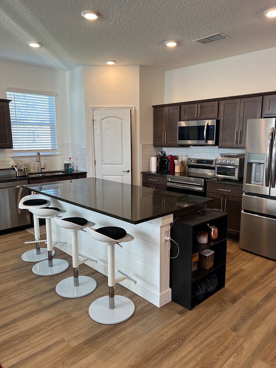Modern kitchen with all new appliances and plenty of storage and counter space and island. Dish and silverware plus all kitchen utensils you need 