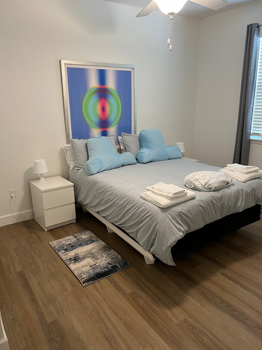 2nd bedroom with a comfortable queen bed and ample closets 