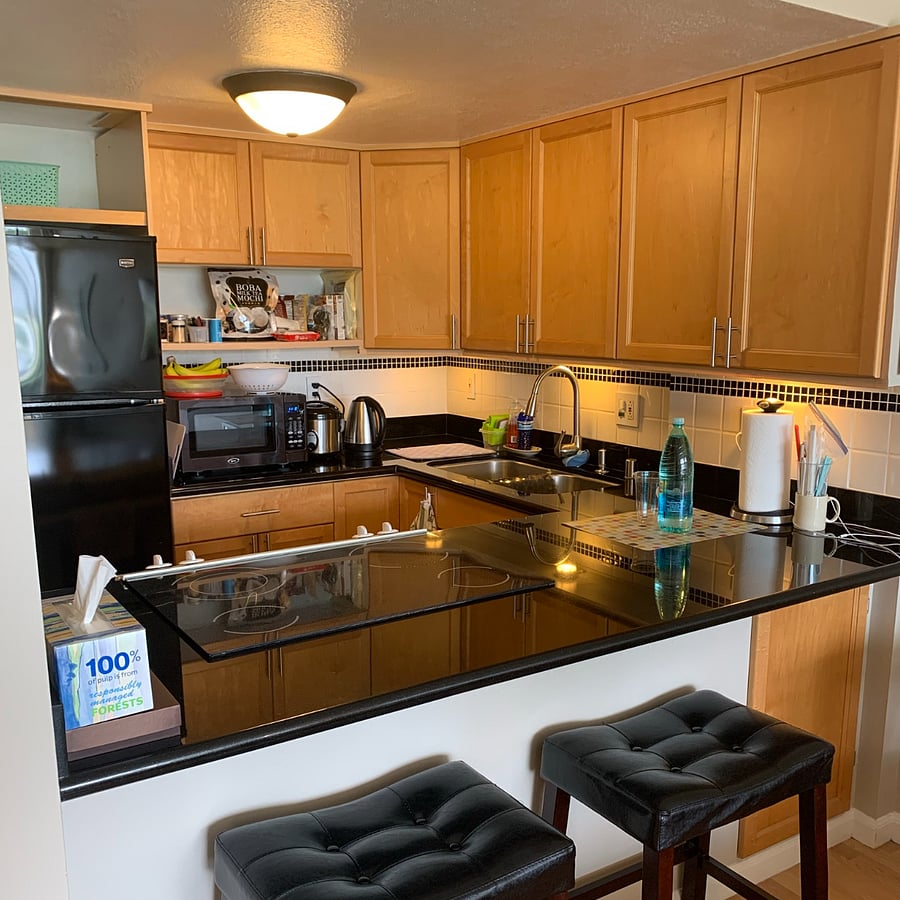 Contemporary kitchen with seating area.